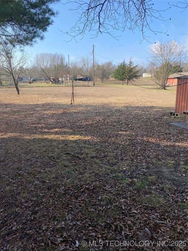 view of yard with a rural view