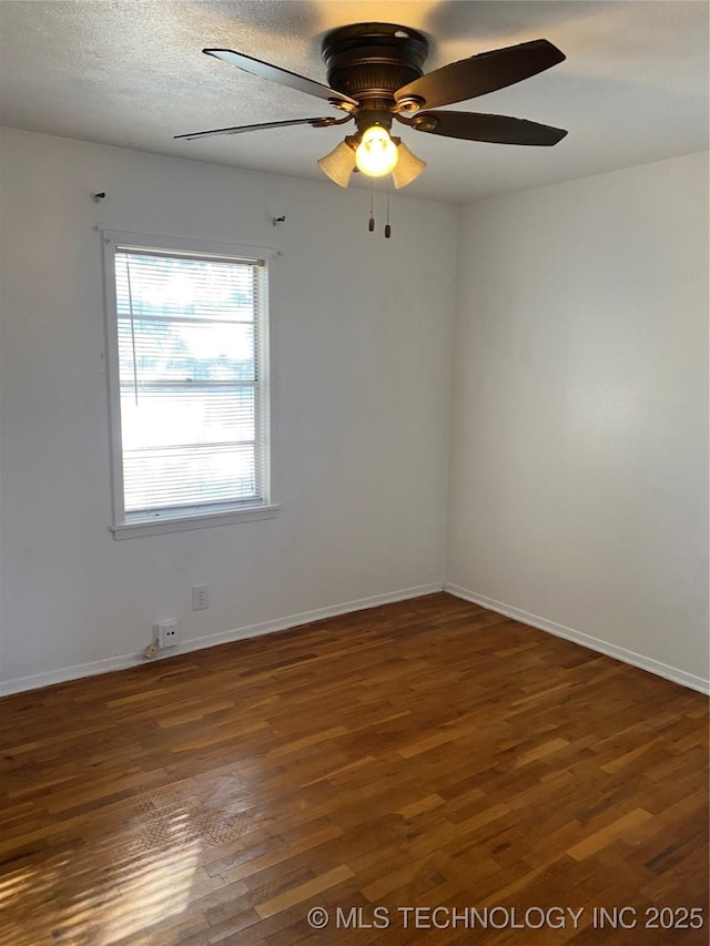 unfurnished room with dark wood-type flooring, ceiling fan, and a textured ceiling