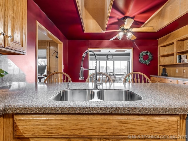 kitchen with ceiling fan and sink