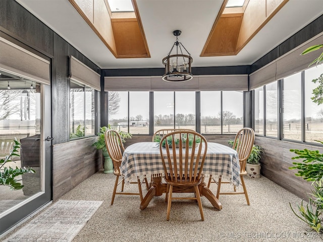 sunroom with an inviting chandelier