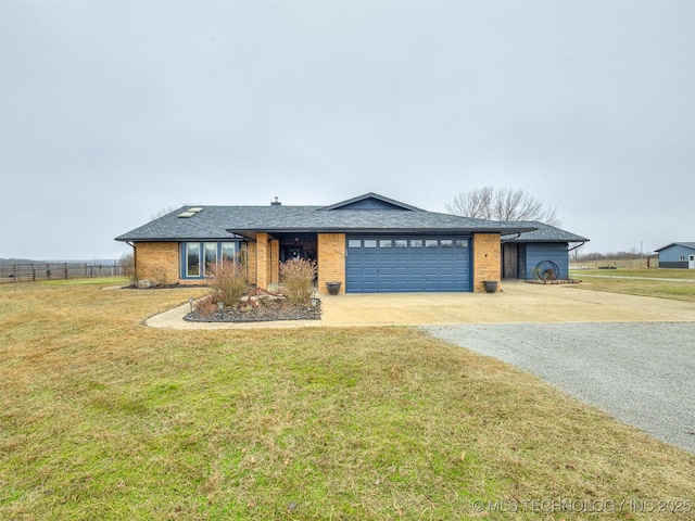 view of front of house with a garage and a front lawn