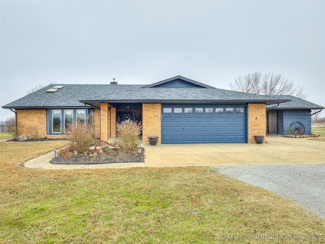 view of front of house with a garage and a front lawn