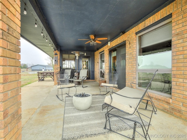 view of patio / terrace featuring ceiling fan