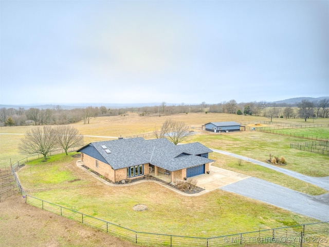 birds eye view of property featuring a rural view