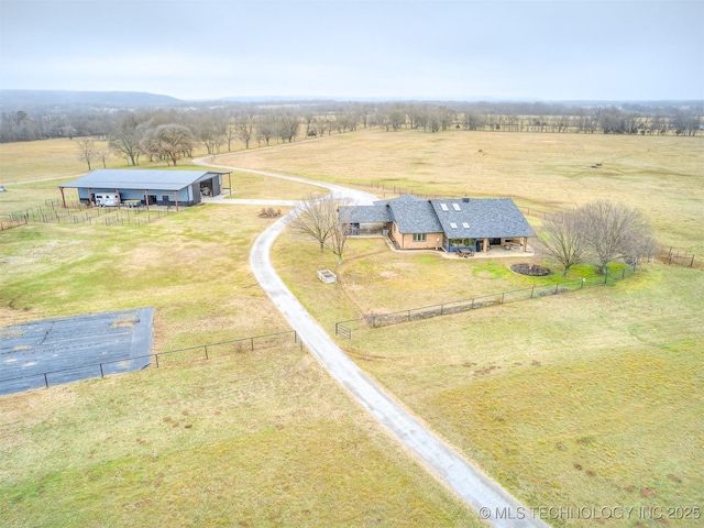 birds eye view of property with a rural view