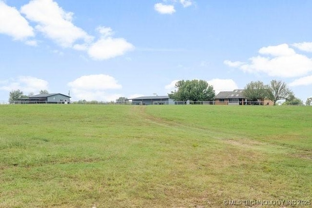 view of yard with a rural view