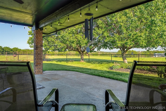 view of patio / terrace featuring fence