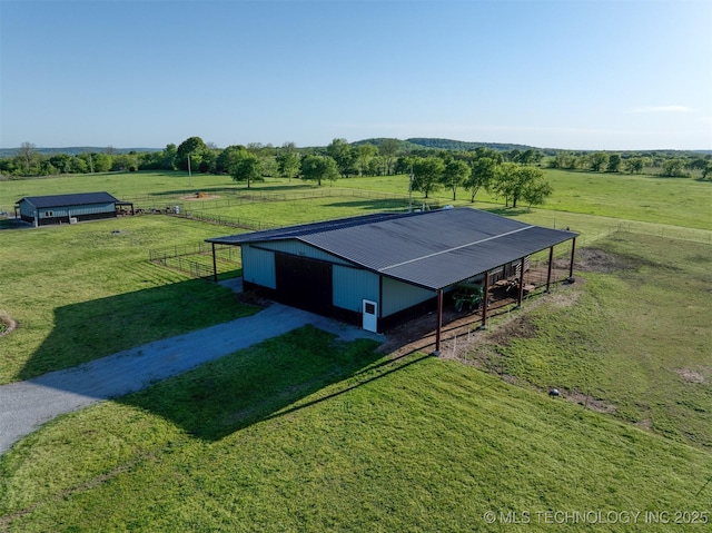 birds eye view of property featuring a rural view