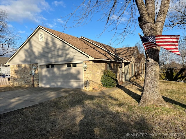 view of property exterior with a garage and a yard