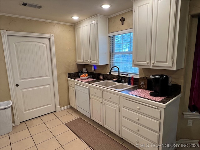 kitchen featuring sink, crown molding, light tile patterned floors, white cabinetry, and white dishwasher