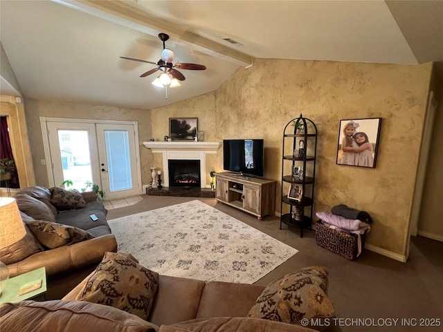 living room featuring vaulted ceiling with beams, french doors, ceiling fan, and dark colored carpet