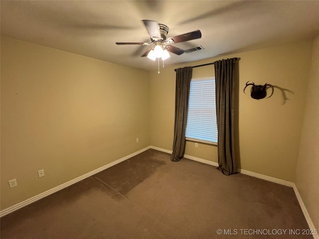 carpeted empty room featuring ceiling fan