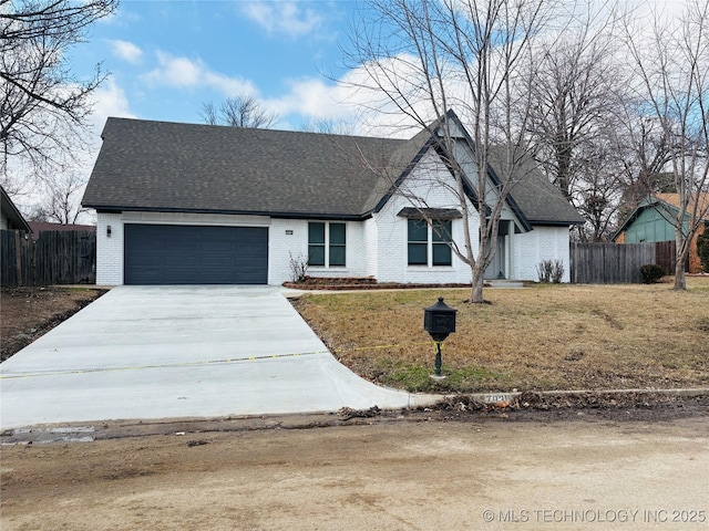 ranch-style house featuring a garage and a front yard