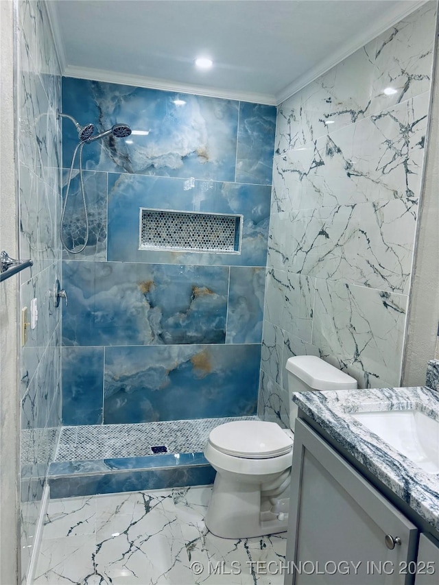 bathroom featuring crown molding, tile walls, tiled shower, vanity, and toilet