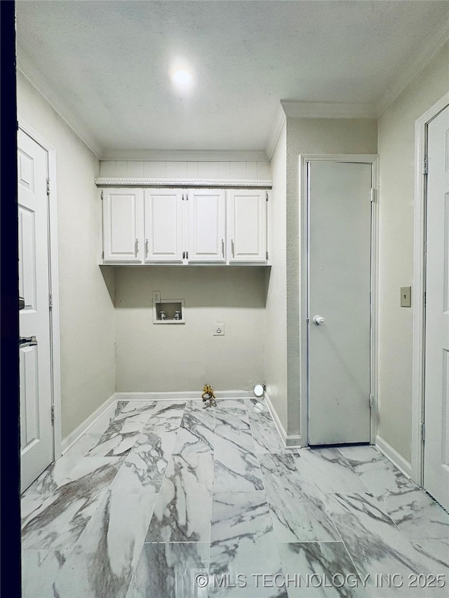 washroom featuring cabinets, crown molding, washer hookup, and hookup for a gas dryer