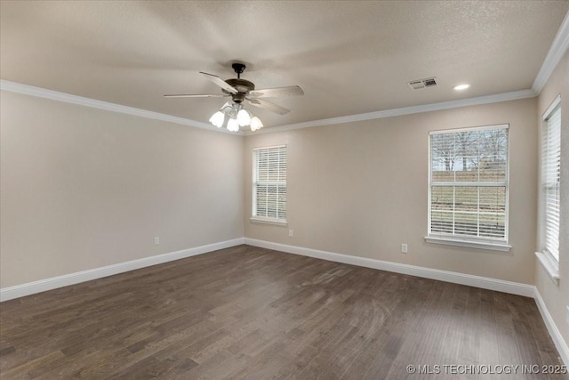 spare room with crown molding, dark hardwood / wood-style floors, a textured ceiling, and ceiling fan