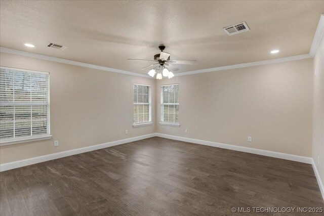 empty room with ceiling fan, ornamental molding, dark hardwood / wood-style floors, and a textured ceiling