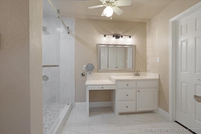 bathroom with ceiling fan, vanity, and a tile shower