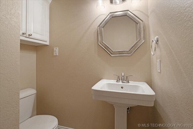 bathroom featuring toilet