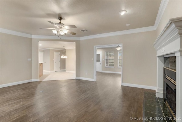 unfurnished living room with dark hardwood / wood-style flooring, ornamental molding, and ceiling fan