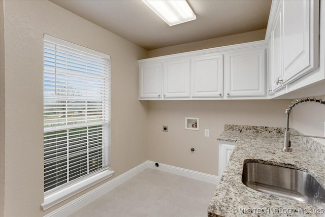 laundry room featuring cabinets, washer hookup, sink, and hookup for an electric dryer