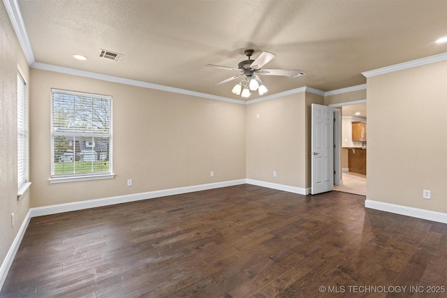unfurnished room with dark wood-style floors, visible vents, baseboards, and a ceiling fan