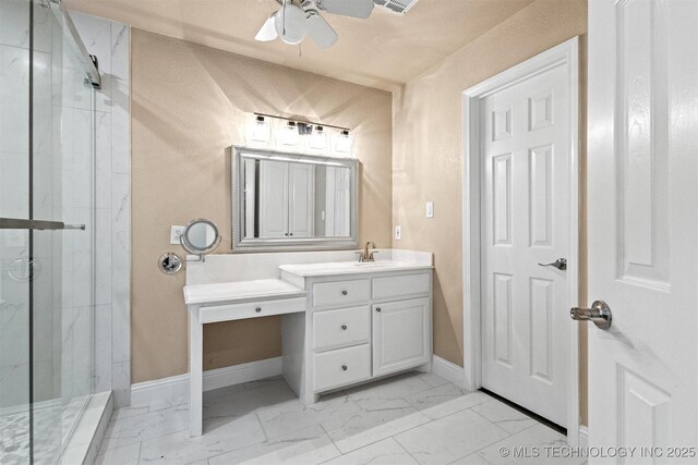 full bathroom featuring baseboards, marble finish floor, ceiling fan, and a marble finish shower