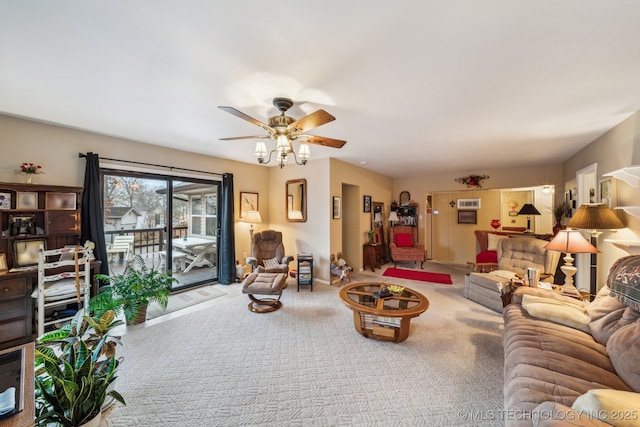 living room featuring ceiling fan and carpet