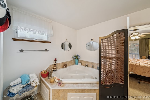 bathroom featuring ceiling fan and a bathing tub