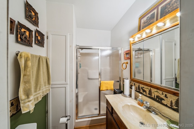 bathroom with vanity and an enclosed shower