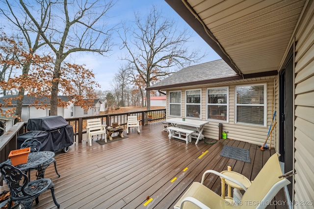 wooden terrace with area for grilling