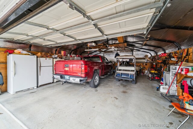 garage featuring white refrigerator