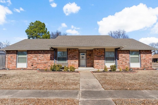 ranch-style home with a front lawn