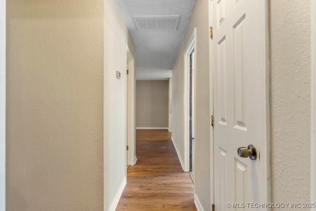 hall with light hardwood / wood-style floors