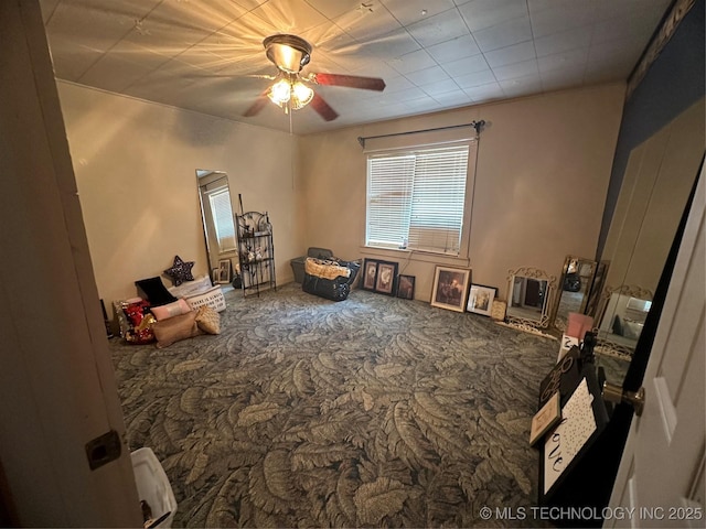 interior space featuring carpet floors and ceiling fan