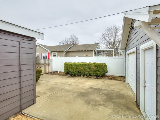 view of patio with a garage