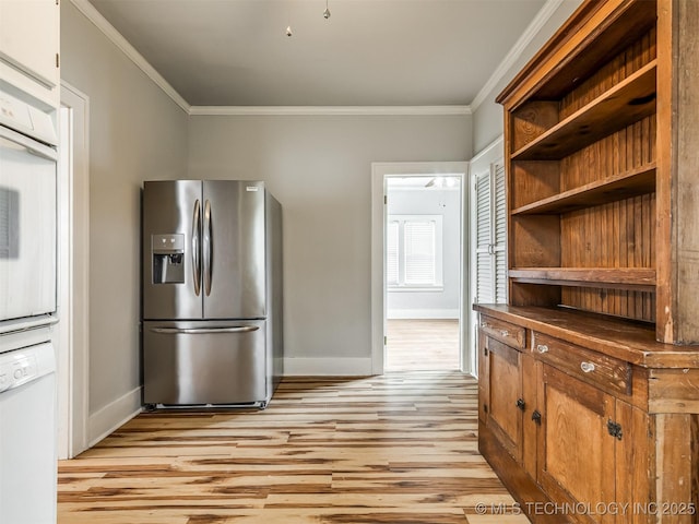 kitchen with white appliances, ornamental molding, and light hardwood / wood-style floors