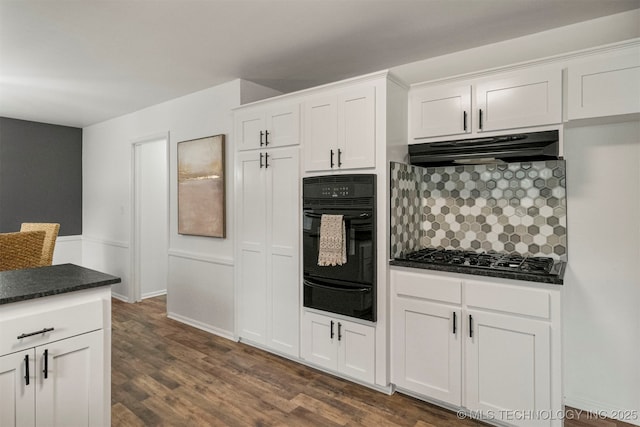 kitchen featuring white cabinetry, dark hardwood / wood-style flooring, black oven, and stainless steel gas stovetop