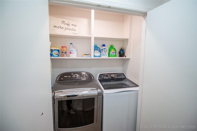 laundry area featuring washing machine and clothes dryer