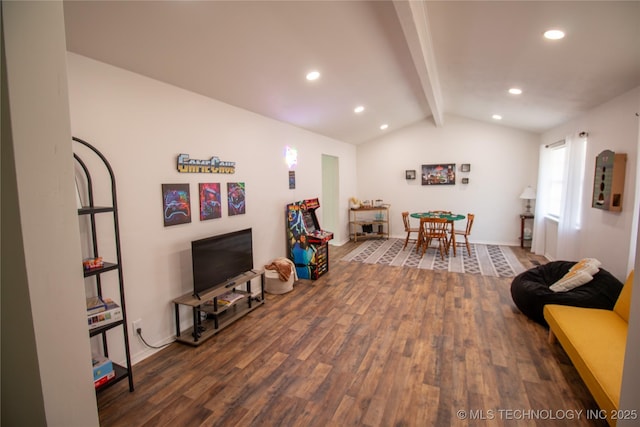 playroom featuring dark wood-type flooring and lofted ceiling with beams