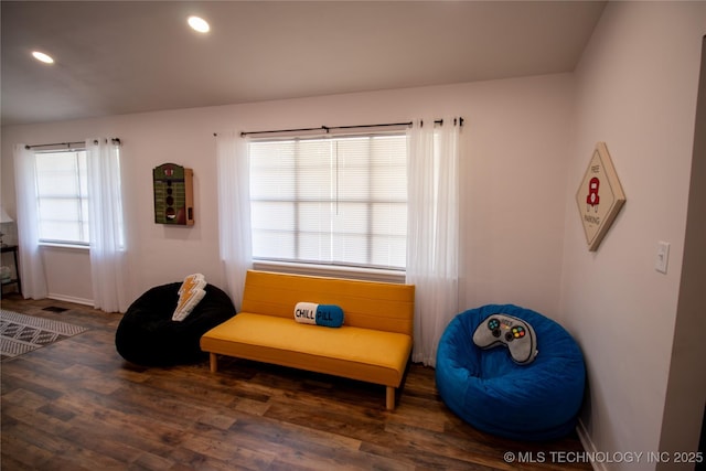 sitting room featuring dark hardwood / wood-style flooring