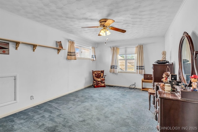 unfurnished room with crown molding, carpet floors, a textured ceiling, and ceiling fan