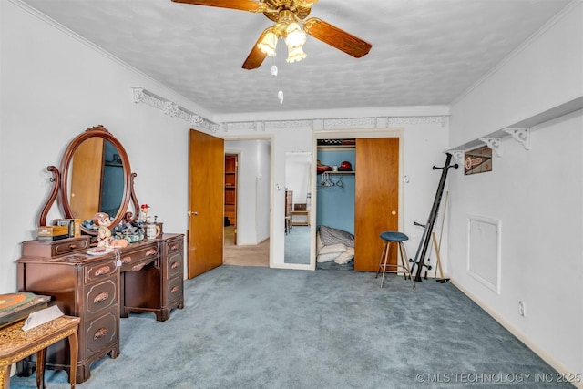 interior space with crown molding, ceiling fan, and carpet flooring