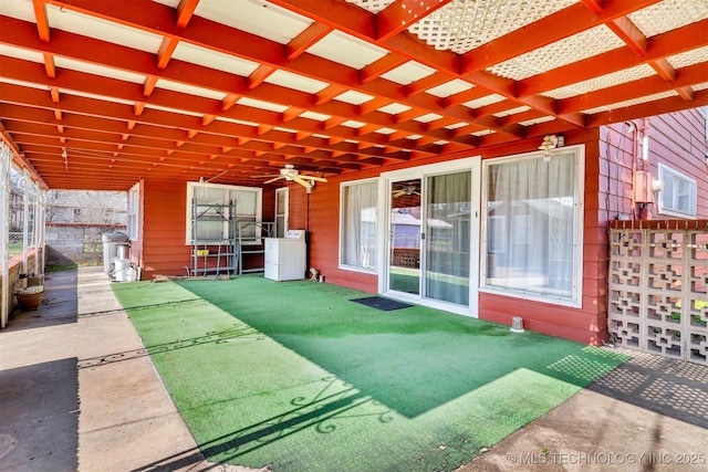 view of patio / terrace featuring ceiling fan, washer / clothes dryer, and a pergola