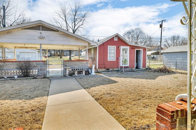 bungalow with a carport and a front lawn