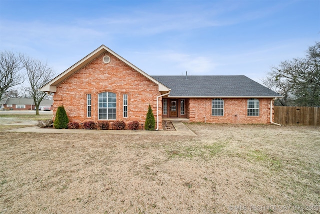 ranch-style house with a front yard