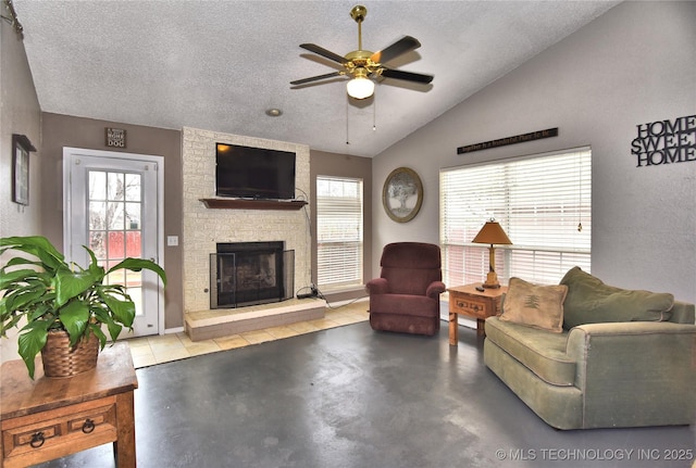 living room with lofted ceiling, a fireplace, and a textured ceiling