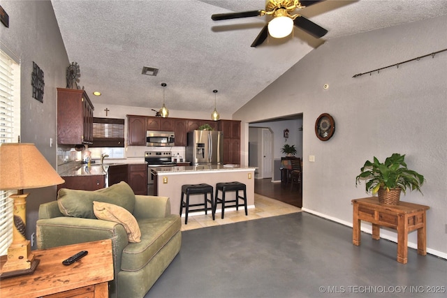 living room featuring vaulted ceiling, sink, ceiling fan, and a textured ceiling