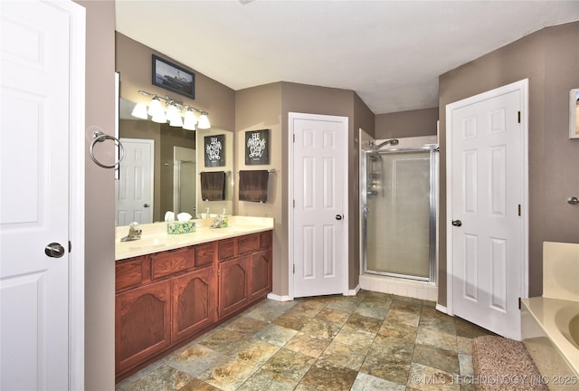 bathroom with vanity and separate shower and tub