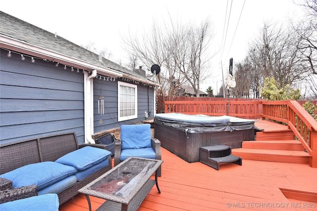 deck with an outdoor living space and a hot tub